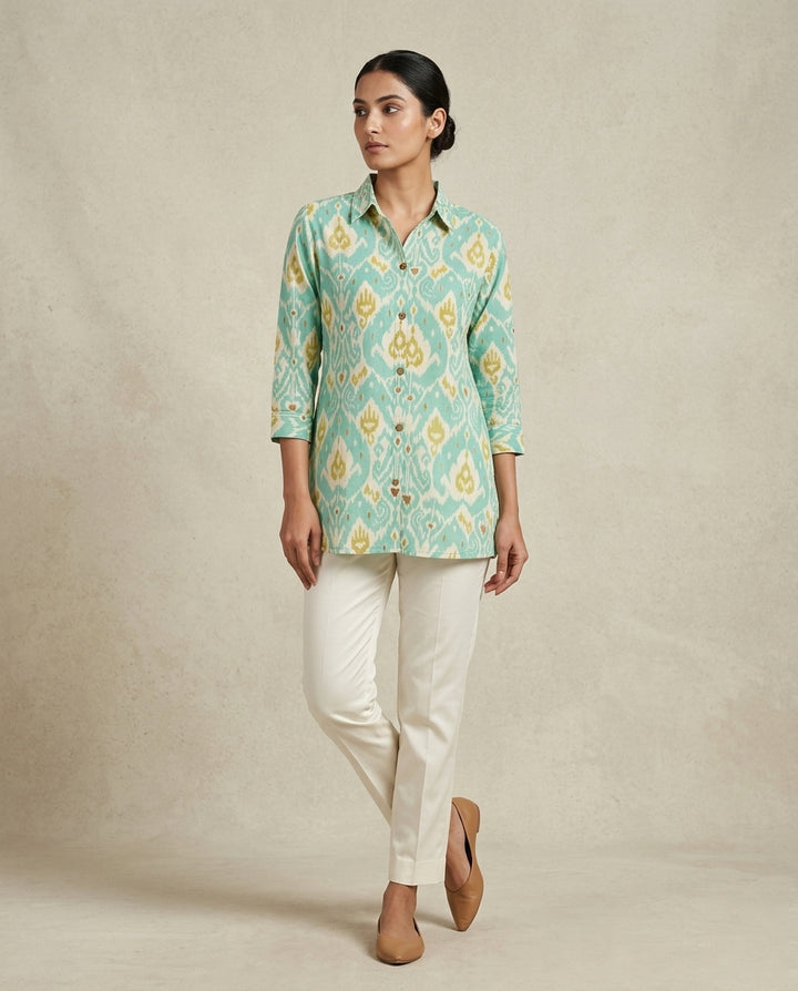Ikat-inspired geometric motif in a refreshing palette of seafoam green,