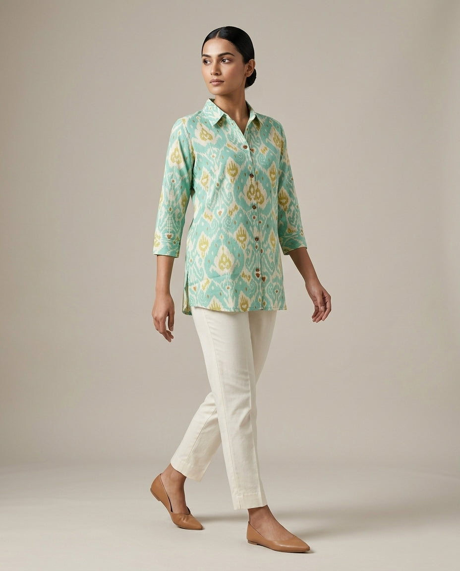Ikat-inspired geometric motif in a refreshing palette of seafoam green,