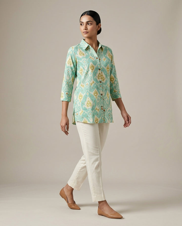 Ikat-inspired geometric motif in a refreshing palette of seafoam green,