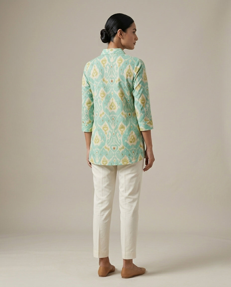 Ikat-inspired geometric motif in a refreshing palette of seafoam green,